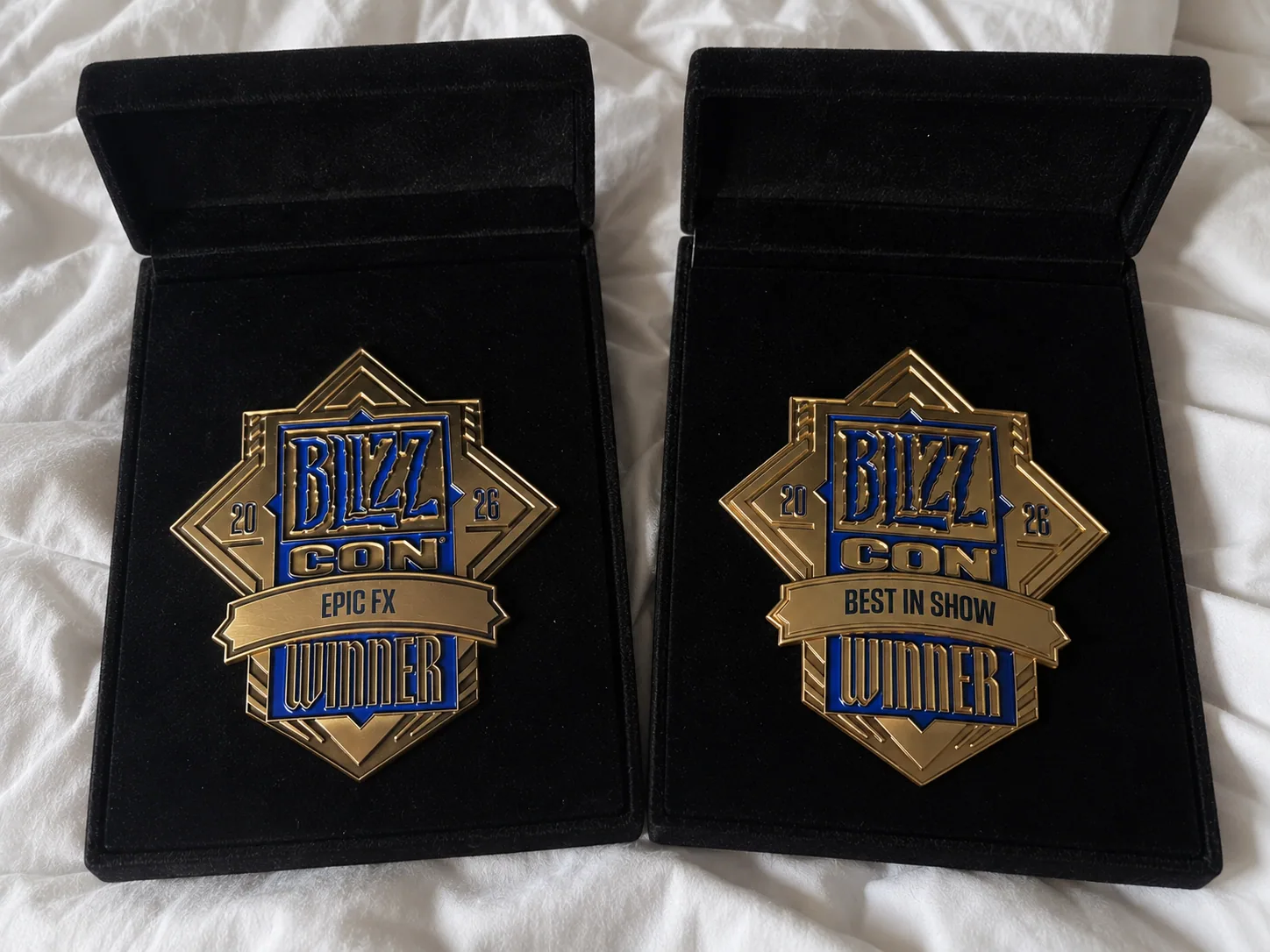 Finished BlizzCon 2026 Epic FX and Best in Show winner medals in gold and blue enamel